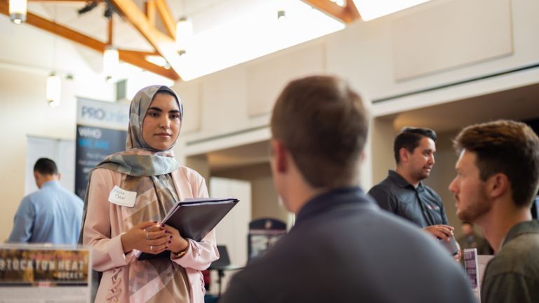 student talking to employer