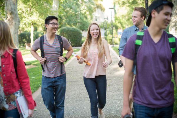 students walk on campus