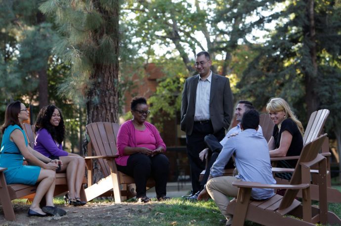 group of students talking in the quad