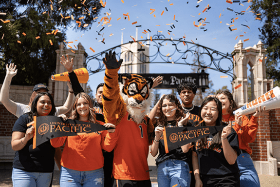 powercat with students at university of the pacific entrance with confetti 