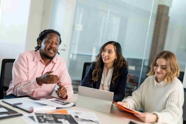 Students work together to on their graduate business project