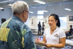 PT student in clinic talking to patient