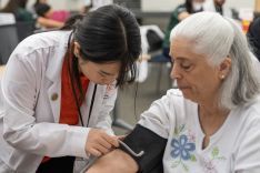  PharmD student with patient at clinic