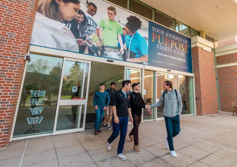 students walk outside the DUC