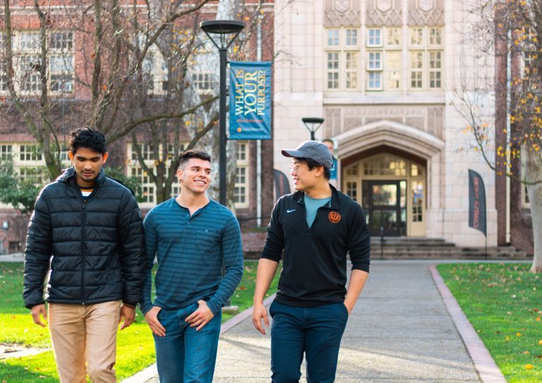 students walk in front of Knoles Hall