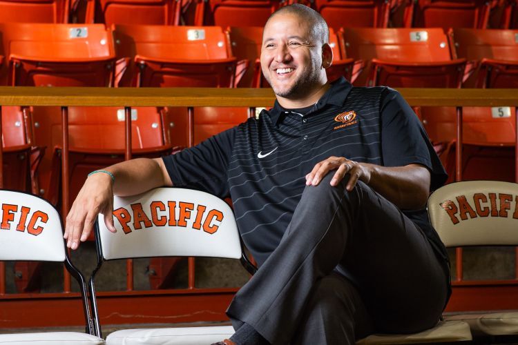 Bradley Davis sits on a chair with text that reads Pacific