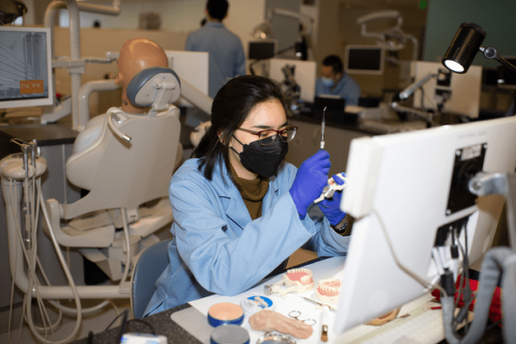 A student works in the simulation clinic