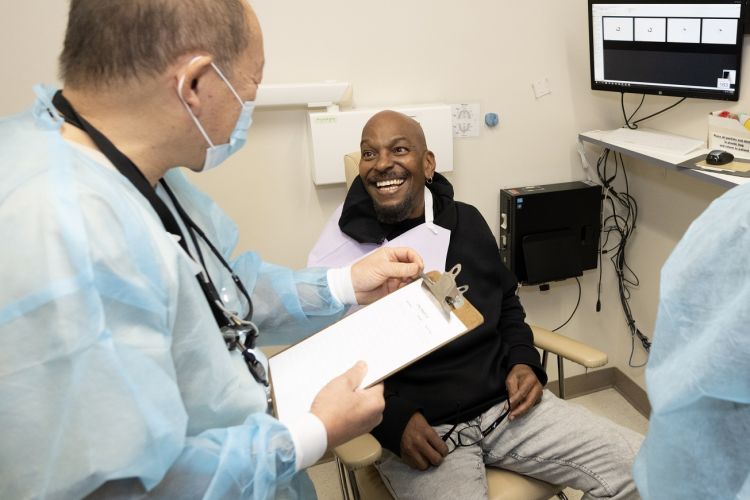 patient sits in dental chair