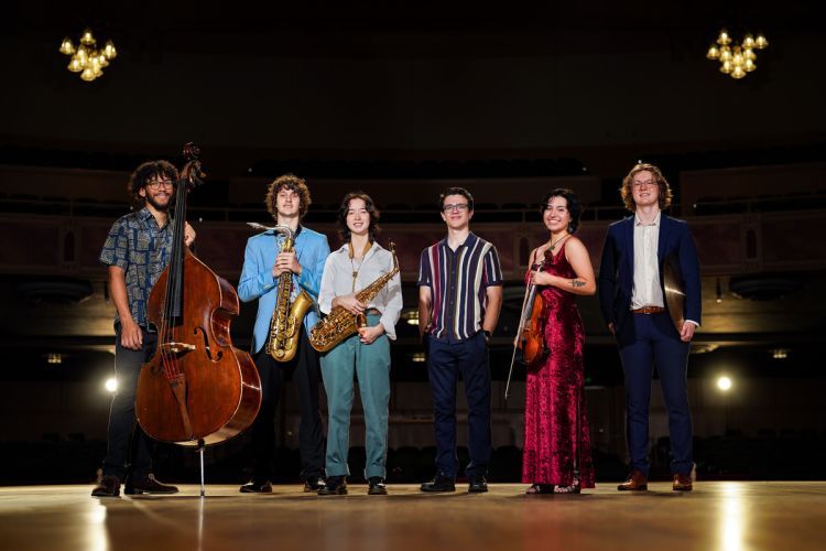 From left to right: Marwan Ghonima '24 (upright and electronic bassist), Leo Milano 26' (tenor saxophonist), Aimee Macdonald '26 (saxophonist), alumnus Toby Keys '22 (pianist), Gianna Pedregon 24' (violinist) and Samson Hulett '24 (drummer). 