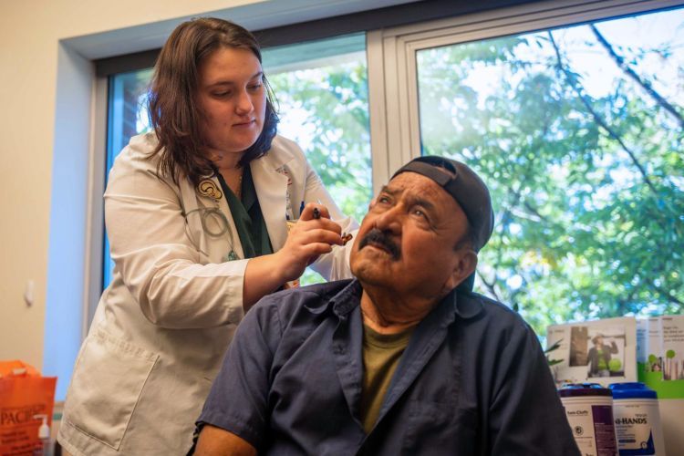 a patient is fitted for a hearing aid