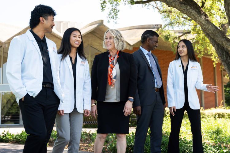 Dean Berit Gundersen and Dr. Srikanth Kolluru with students