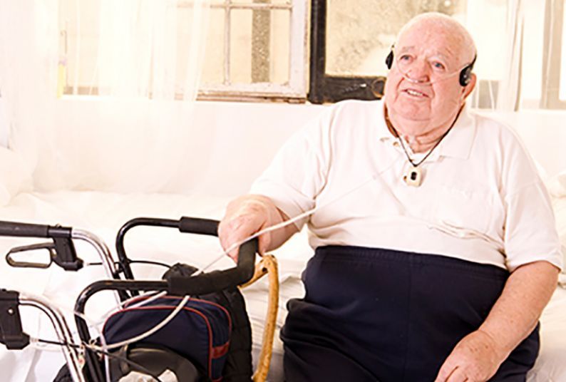 older man with assistive equipment