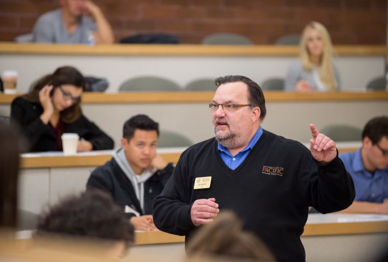 Professor Francis J. Mootz III speaks to a classroom of students while making a hand gesture.