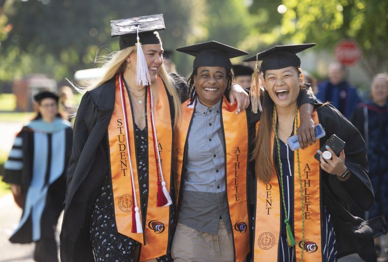 Pacific graduates attend a commencement ceremony