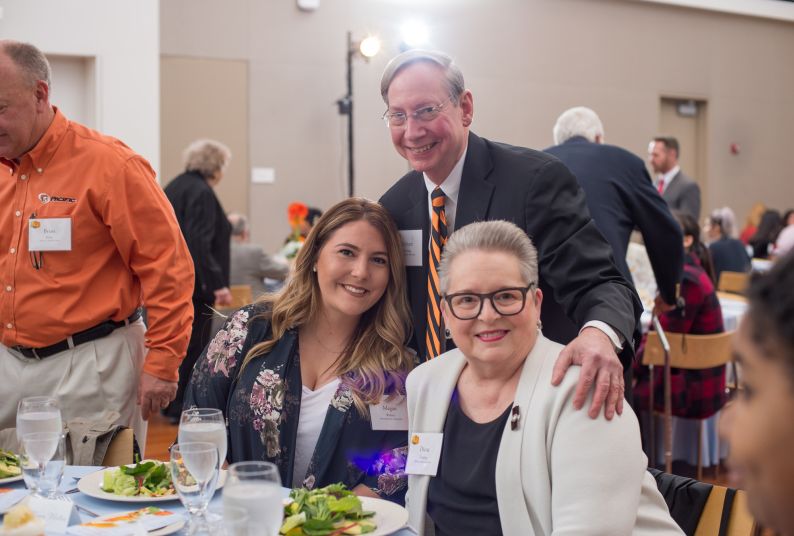 Photo of Pacific scholarship recipient with Rick and Diana Fleming