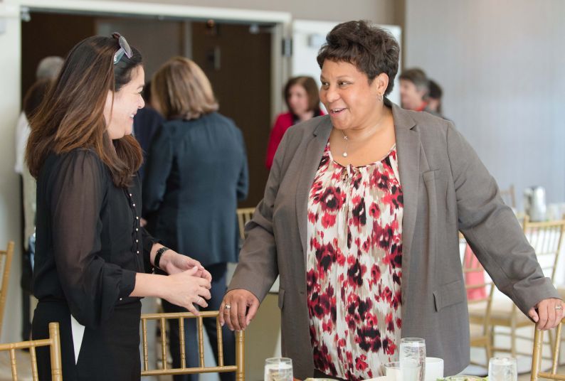 Two women talking to each other