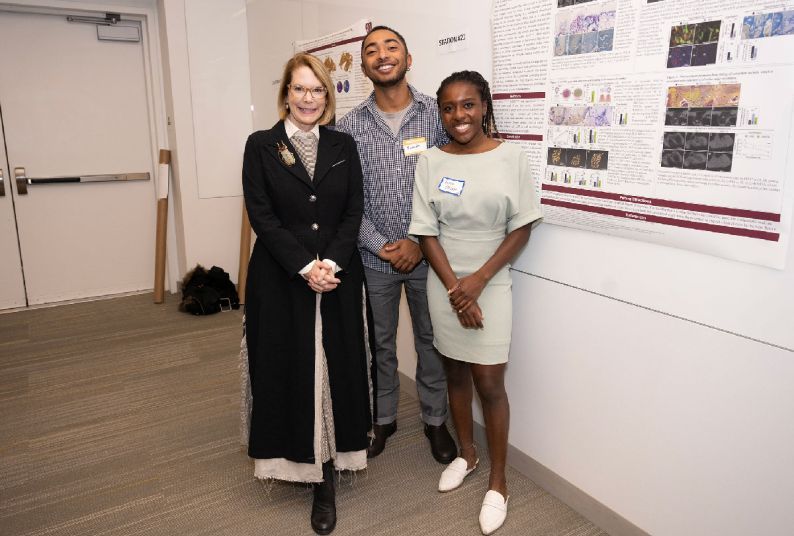 attendees and presenters at the symposium