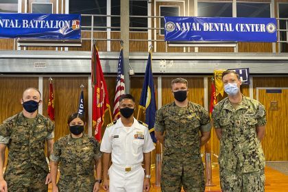 Left to Right: Lieutenant Adam Gluskin ’17, Commander Sherry Caraveo ’04, Captain Jerome Ragadio ’03, Lieutenant Michael Lawrence ’16 and Lieutenant Commander Eric Frederiksen ’11. (Not pictured: Lieutenant Commander Michael DeFazio ’13)