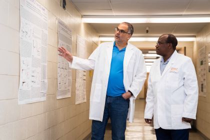 Associate Professor Carlos Villalba-Galea and graduate research assistant Moses Kamwela ’26