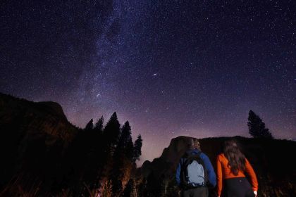 Students in Yosemite gazing at the starry sky above