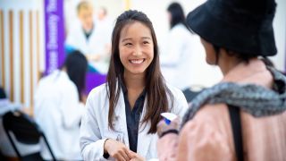 Doctor of pharmacy student with patient at Medicare Part D clinic