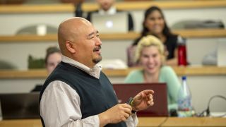 A professor addresses a classroom