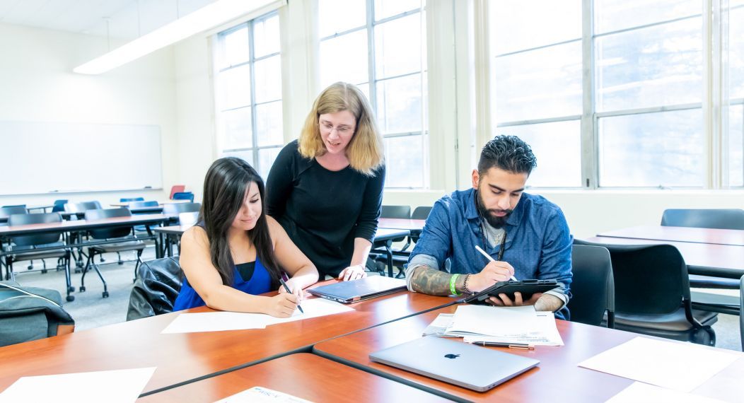 professor with students in classroom