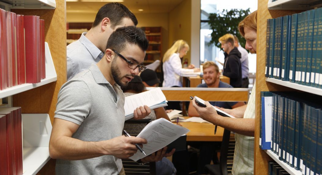 gls students talking in the legal studies center