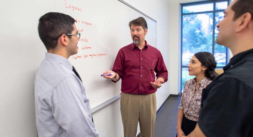 students in classroom with professor