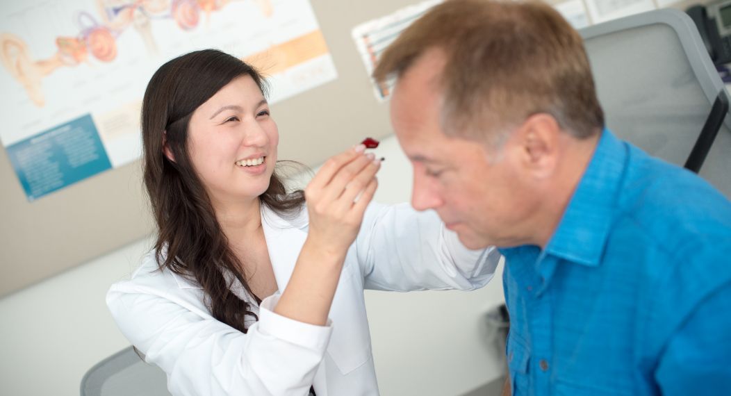 Audiology student with patient