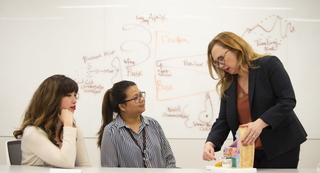 audiology professor and students in classroom