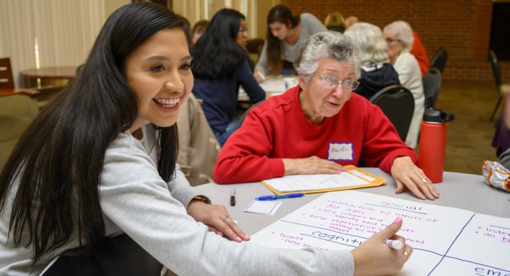 Pacific students and OLLI members discuss together