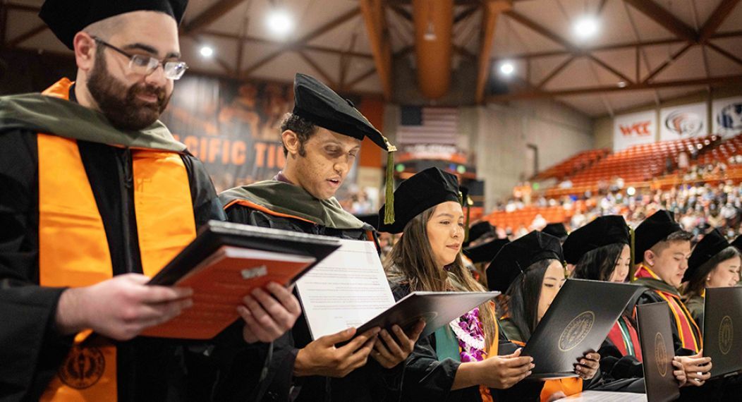 Pharmacy graduates reading their oaths