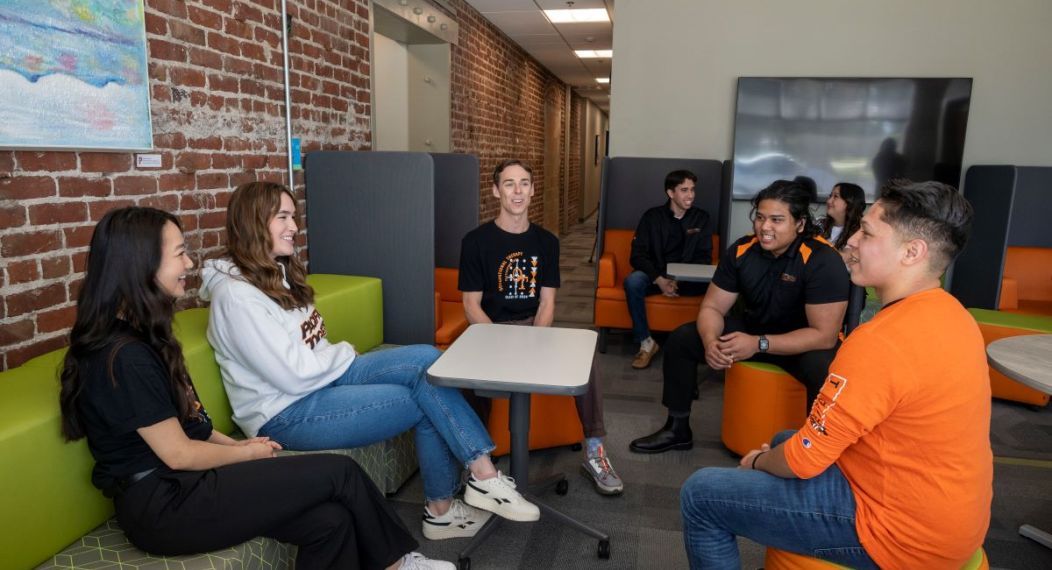 OT students talk together in a lounge area