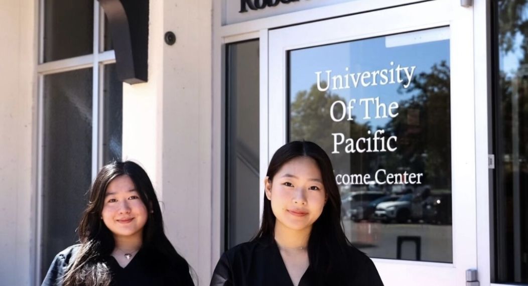 two pre-health students in front of burns tower