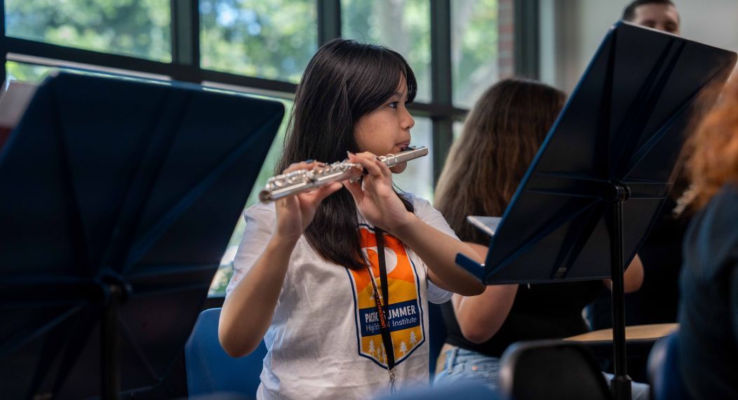 Student playing instrumental 