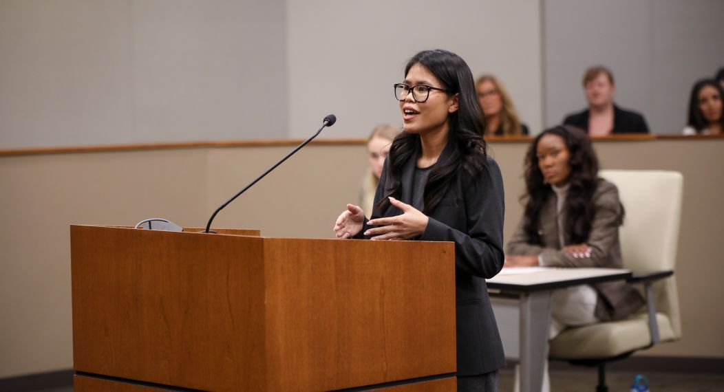 Student standing at podium