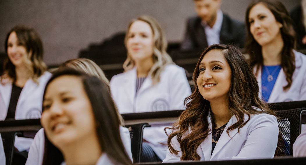 Photo shows Pacific PA students listening to a lecture in a classroom.