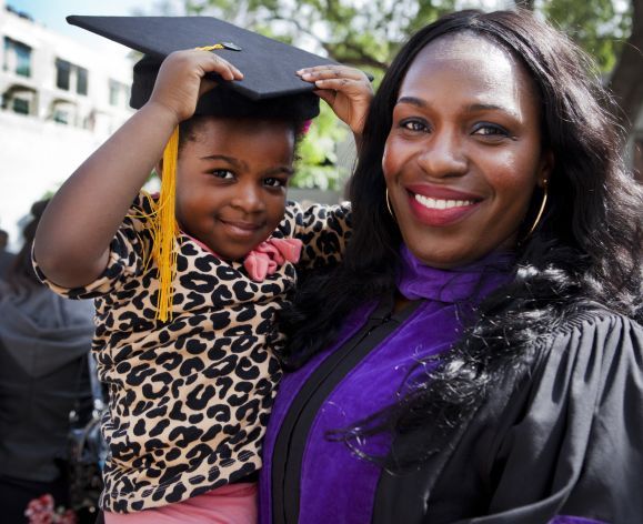 McGeorge graduate holding child