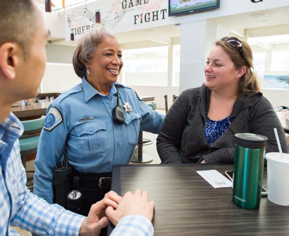 Campus Peace Officer with students