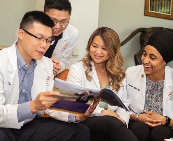 four doctor of pharmacy students in lounge