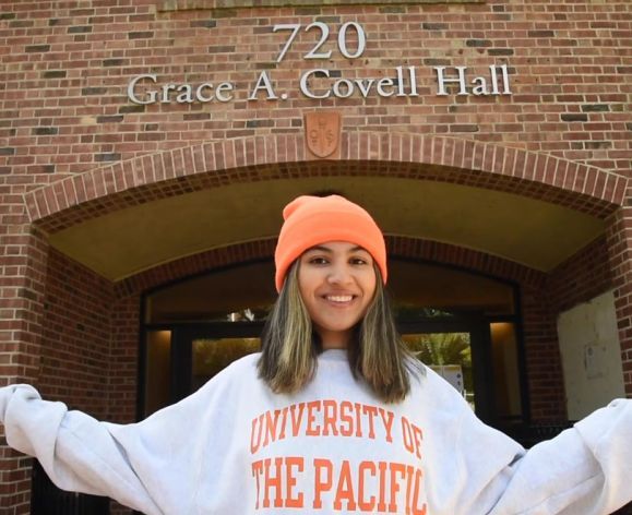 Pacific student outside a residential hall