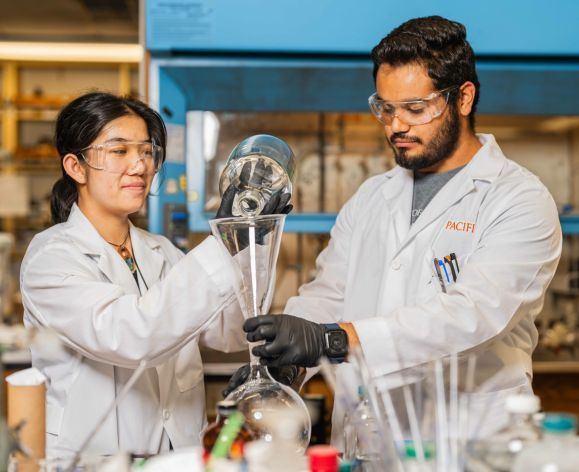 Two students in a research lab