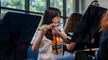 Student playing instrumental 