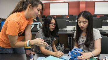 Students building a device